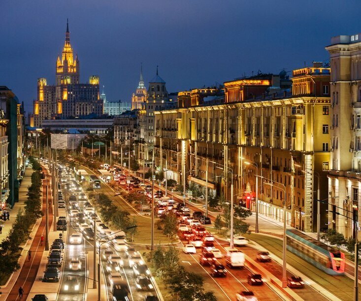Garden Ring road in Moscow at night with busy traffic and illuminated city buildings