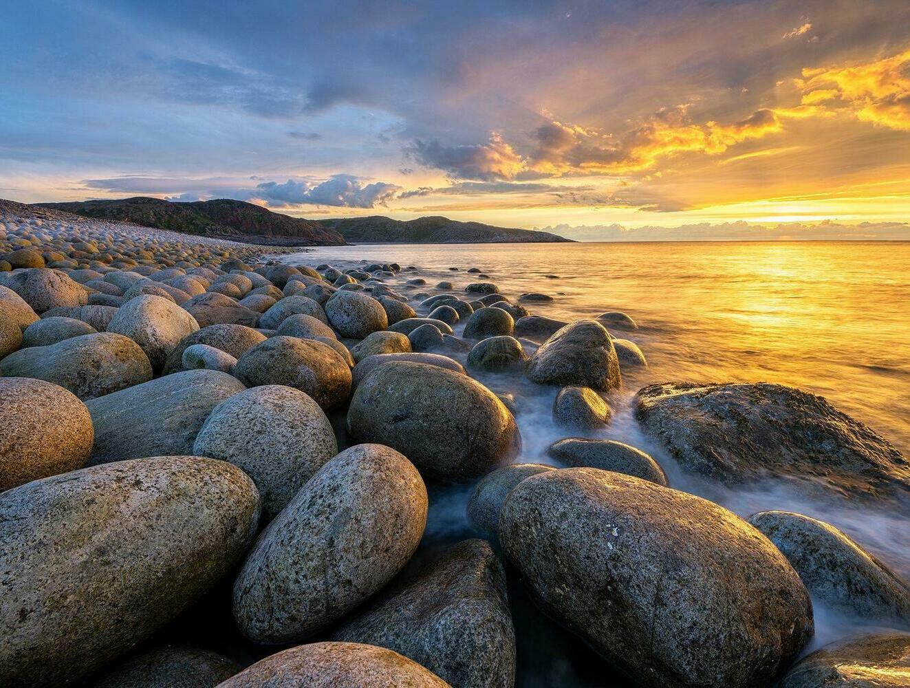 Dragon Eggs Beach in Teriberka Dragon Eggs Beach with rounded boulders along the Barents Sea coast in Teriberka, Russia