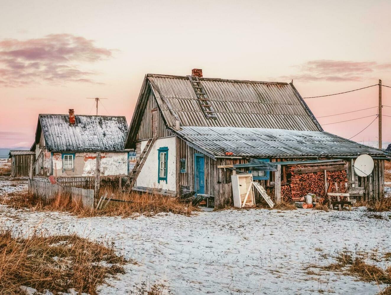 Teriberka Fishing Village on the Arctic Coast Traditional wooden houses in Teriberka fishing village on the Arctic coast of Russia