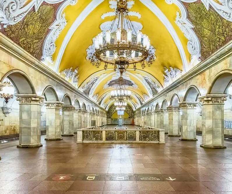 Ornate interior of Komsomolskaya Metro Station in Moscow with chandeliers and decorative ceilings