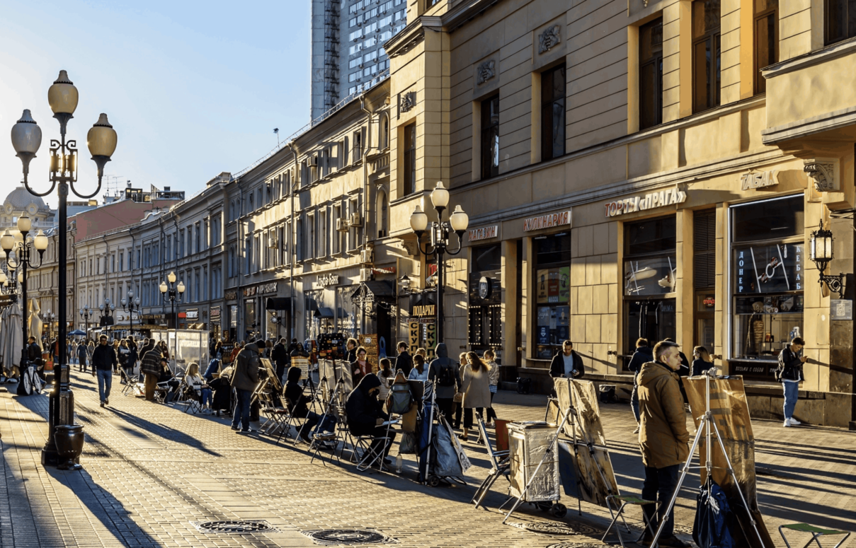Arbat Street in Moscow, a historic pedestrian street lined with shops, cafes, and traditional buildings